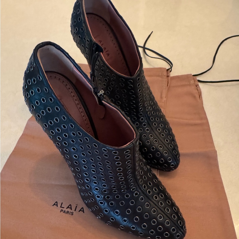 Alaia Black Ankle Boots with Silver Eyelets